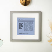 A minimalist framed lyric print of “Detectorists” by Johnny Flynn. The design features a muted blue background with black text and a central lyric quote: “Will you search through the loamy earth for me?” Below, it’s personalized with “Sophie and Graham | 13 May 2016 | Our First Dance.” The light gray frame sits on a white wall next to dried flowers, creating a calm and timeless aesthetic.