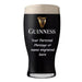 Black Guinness beer glass with white text on a white background