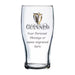 Clear Guinness beer glass with engraved text area on a white background