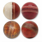 Four vintage cricket balls arranged in a 2x2 grid on a plain white background, showing different stages of aging and wear.