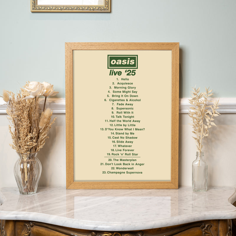 Framed Oasis 'Live '25' album tracklist on a decorative shelf with flowers.