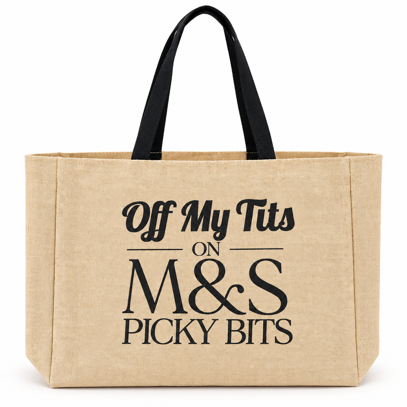 A natural beige canvas tote bag with black handles and black printed text reading 'Off My Tits ON M&S PICKY BITS' on a white background.