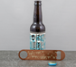 Personalised bronze bottle opener engraved with “Mr & Mrs Richards – Celebrate Marriage Forever Always,” shown beside a BrewDog Punk IPA bottle and cap on a grey tabletop.