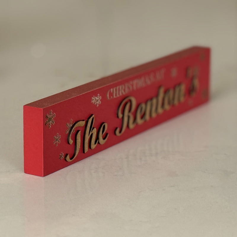 Personalised Freestanding Christmas Sign – Custom Family Name Wooden Decoration | ‘Christmas At’ Snowflake Design in Red, White or Grey | Holiday Mantel & Shelf Décor Gift