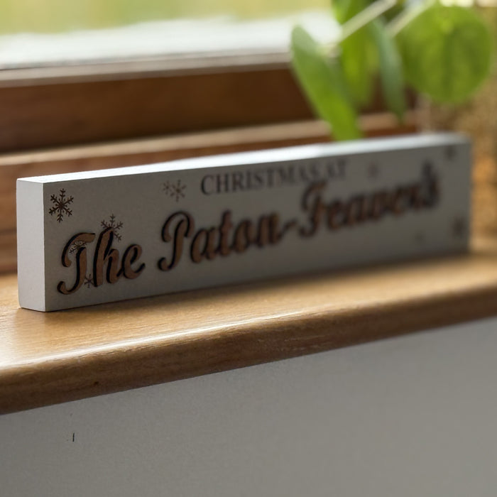 Personalised Freestanding Christmas Sign – Custom Family Name Wooden Decoration | ‘Christmas At’ Snowflake Design in Red, White or Grey | Holiday Mantel & Shelf Décor Gift