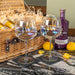 Two personalised gin glasses engraved with “JW,” paired with a wicker hamper filled with Whitley Neill gin, Fever-Tree tonic cans, and lemons.