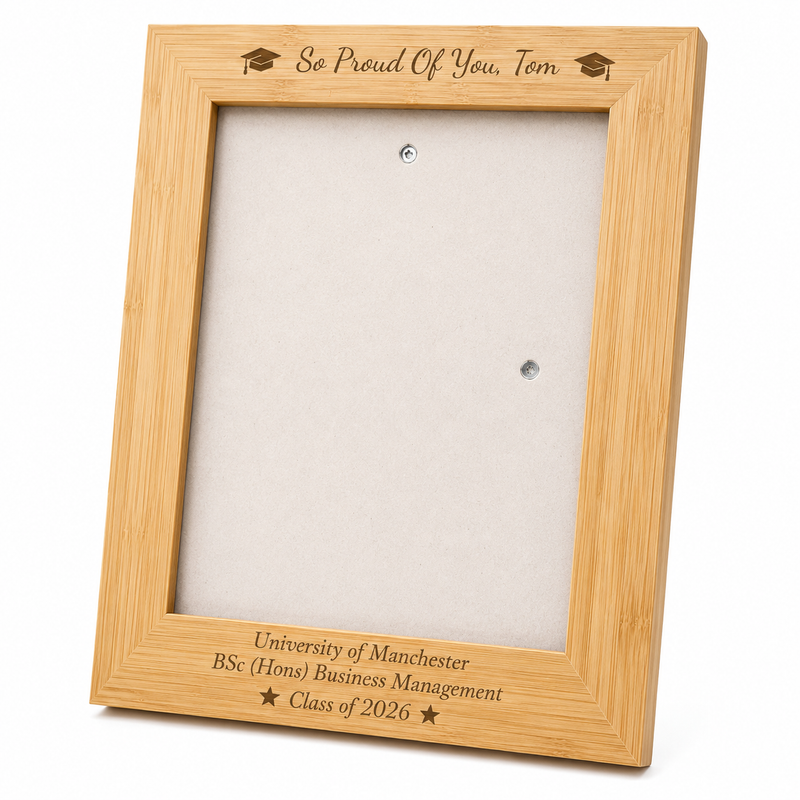 Personalised bamboo graduation photo frame engraved with the graduate's name, university, degree and graduation year, displayed with a graduation portrait.