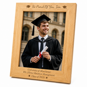 Personalised bamboo graduation photo frame engraved with graduate's name, university, degree and year, displayed with a graduation portrait