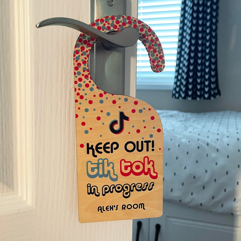 Tik Tok in progress door hanger on teenager bedroom door